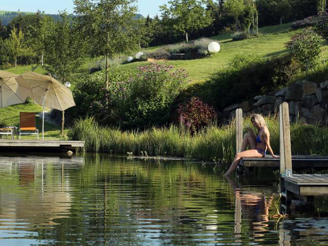 woman relaxing at the natural swimming lake