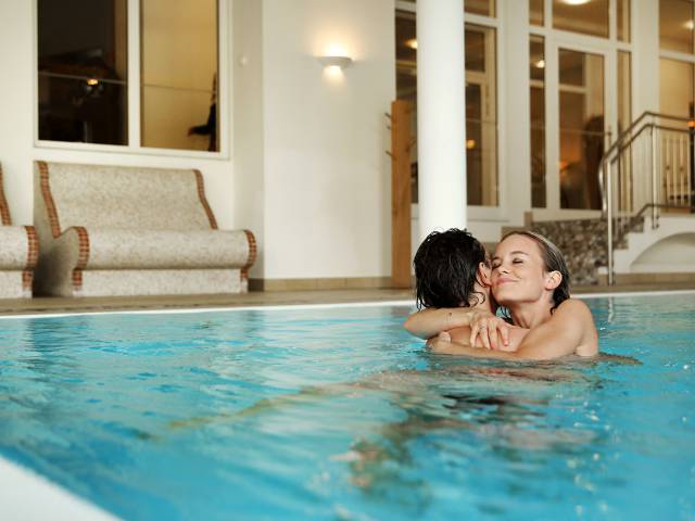 romantic couple in the pool